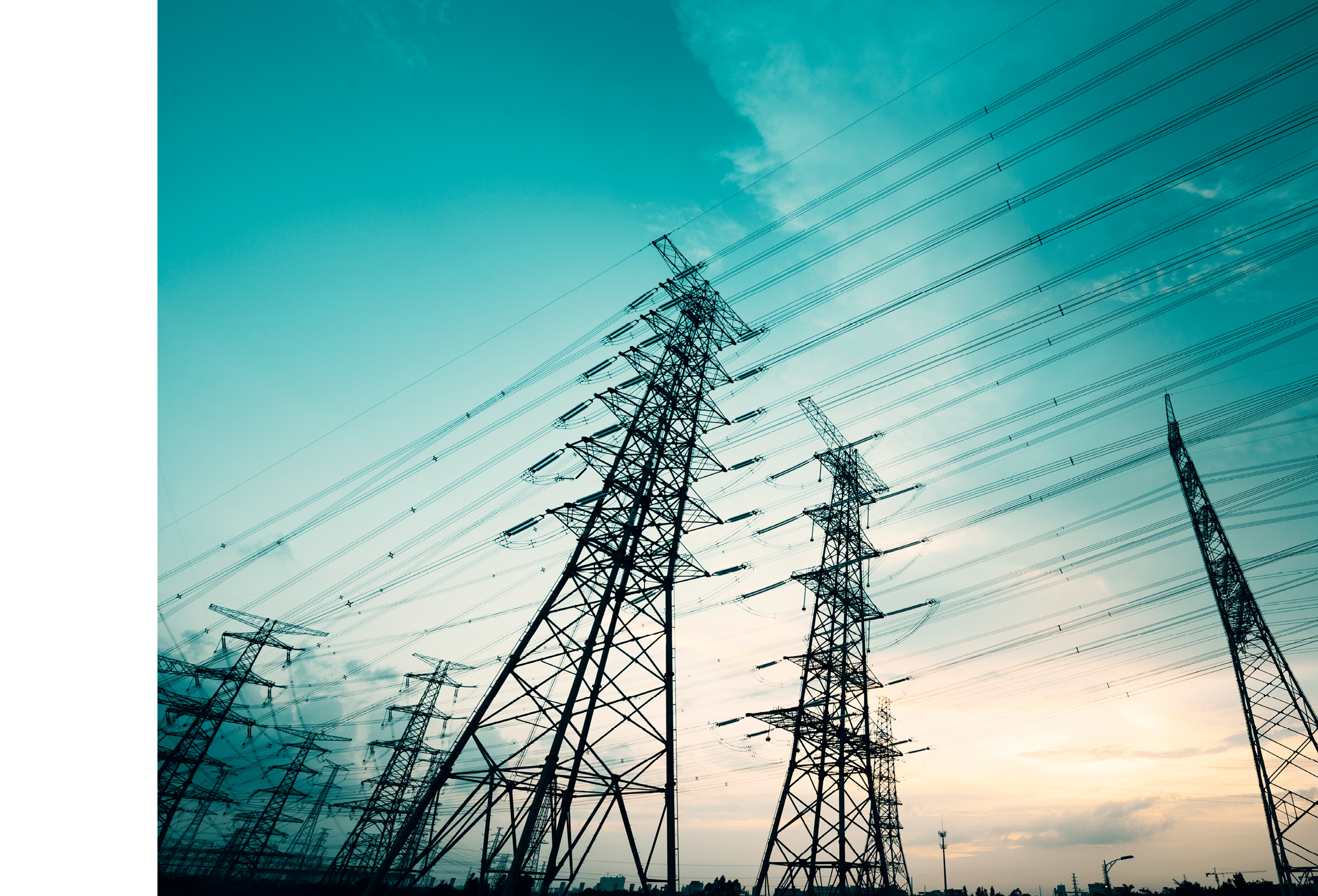 High voltage towers in the dusk of the evening